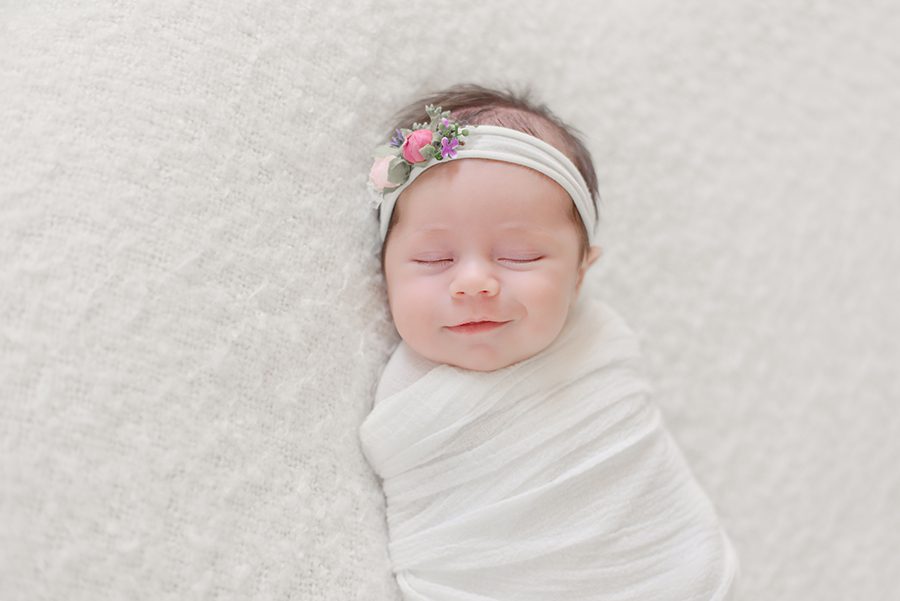 Natural fun studio newborn session of a family of 5 with a brand new baby girl