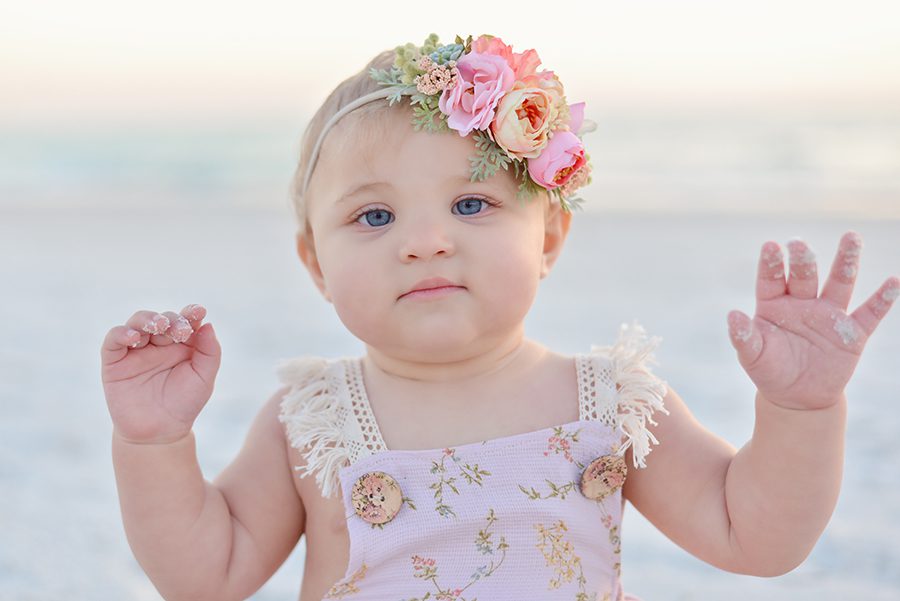 Nine month old baby girl session at the beach. Pastel photo session at Redington Shores. Family photo session at Clearwater Beach.