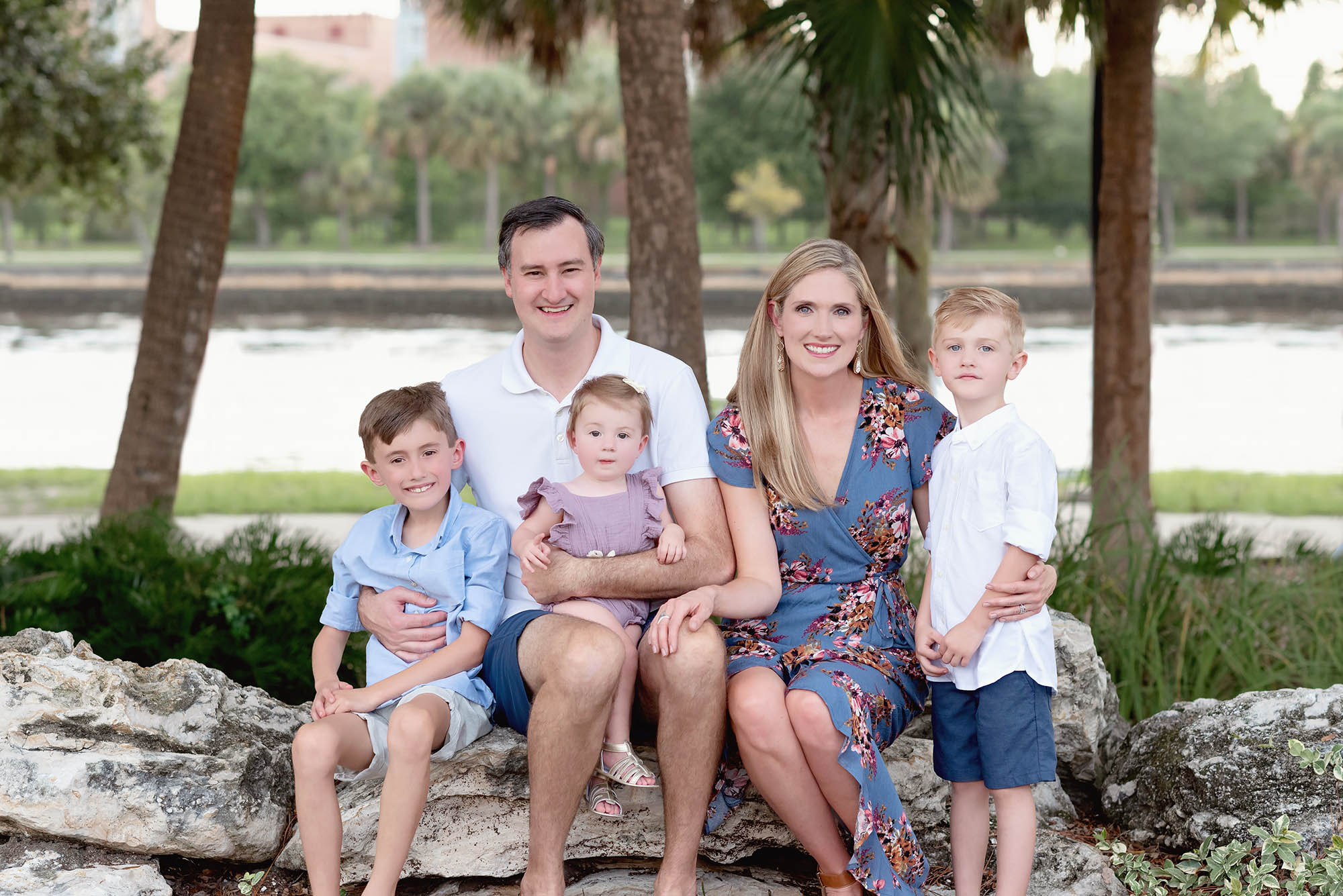 Young family of 5 getting portraits done in a park in Tampa, Florida