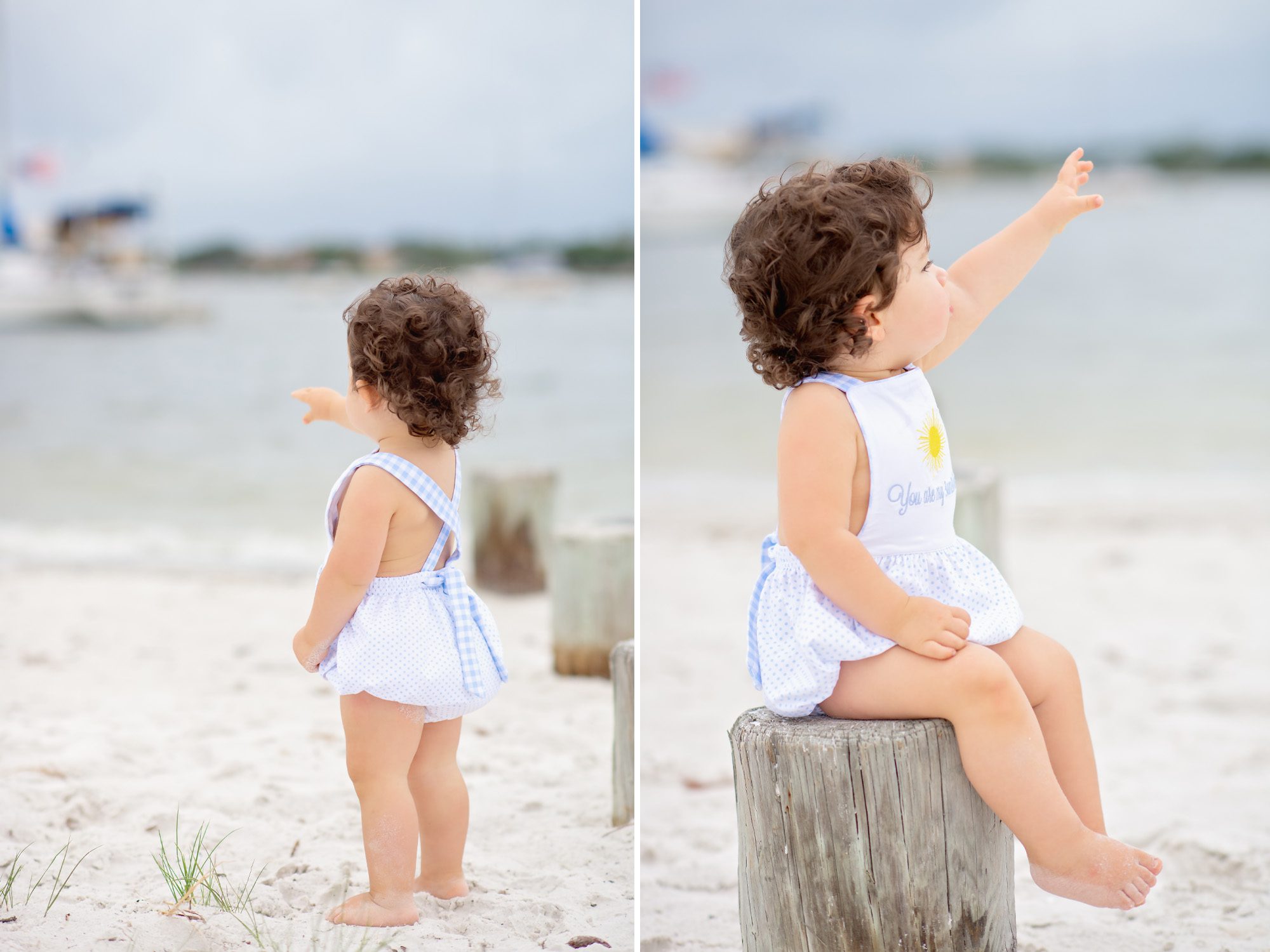 A sweet 18 month old little boy with long dark curls gets his photos taken on an overcast windy day at the beach in Tampa, Florida.