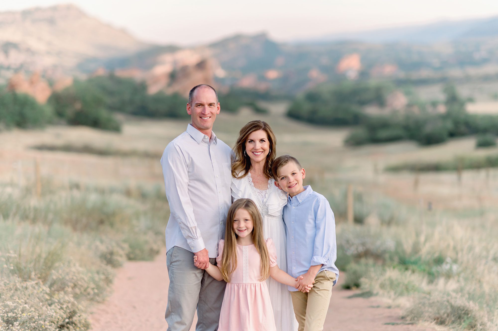 Family of four gets fun natural portraits done at south valley park in Littleton, Colorado